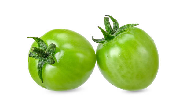 istock Green tomato isolated on white clipping path 1093459696