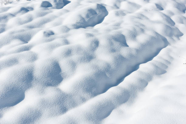 istock Large snowdrifts on a snowy field 1093462996
