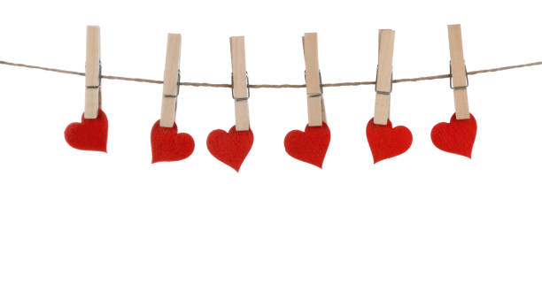 istock Clothes pegs and hearts on rope 1093468370