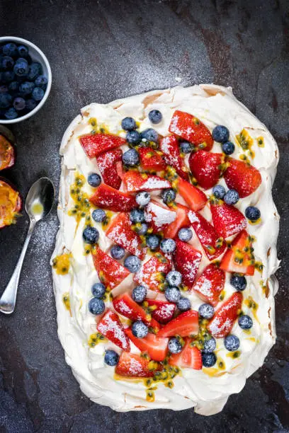 Photo of Pavlova Meringue Cake with Berries and Passionfruit
