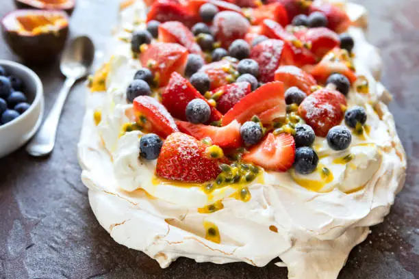 Photo of Pavlova Meringue Cake with Berries and Passionfruit