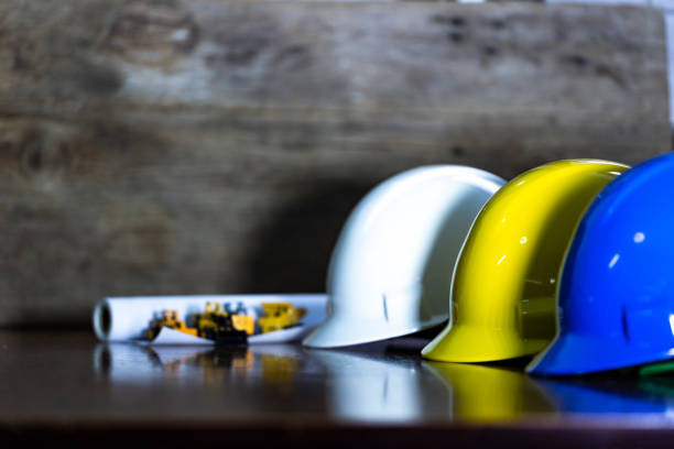 istock Engineer, electrician and worker 's helmet color as White, Blue and Yellow , PPE  (Personal Protective Equipment) very importance for health protection. Safety at work concept 1093474792
