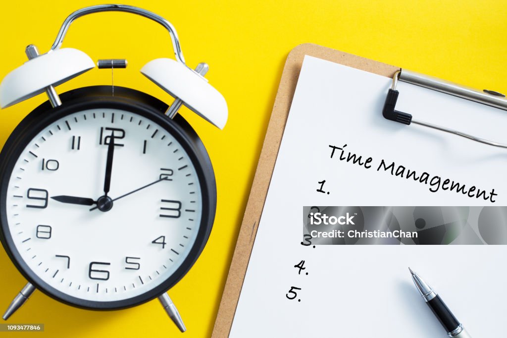 Time Management Concept With Clock Time management concept. Alarm clock on yellow background. Time Stock Photo