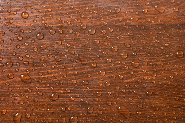Beautiful wooden background with water drops. Top view