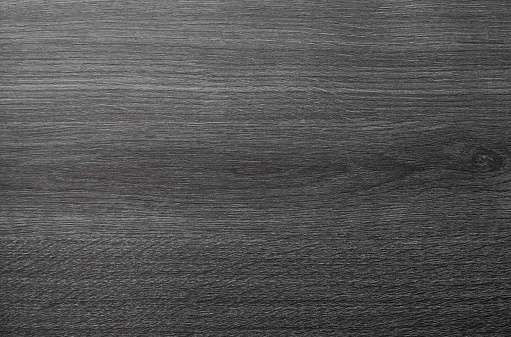 brown wooden texture background, dark oak of weathered distressed washed wood with faded varnish paint showing woodgrain texture. wash hardwood planks pattern table top view