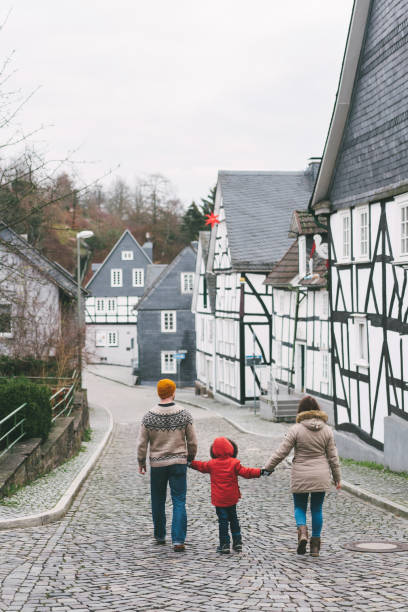 istock Family walking in Freudenburg town 1093483706