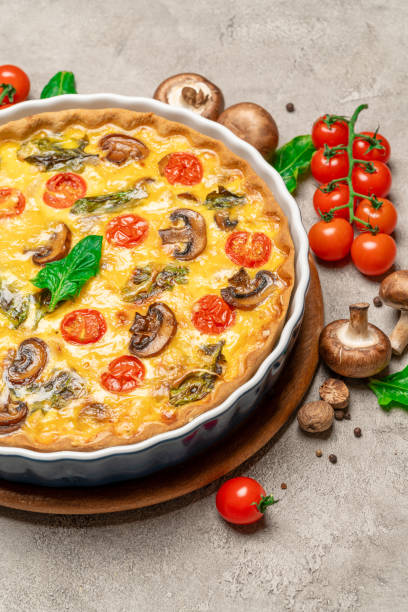 istock Baked homemade quiche pie in ceramic baking form 1093487380