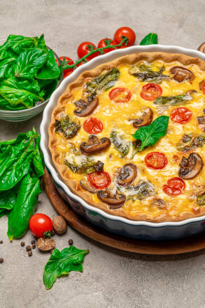 istock Baked homemade quiche pie in ceramic baking form 1093487390