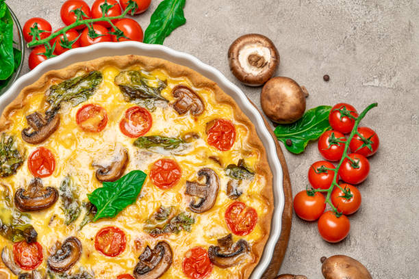 istock Baked homemade quiche pie in ceramic baking form 1093487396