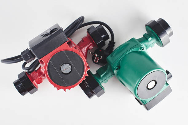 istock Red and green circulation pumps for heating on a white background. 1093487732