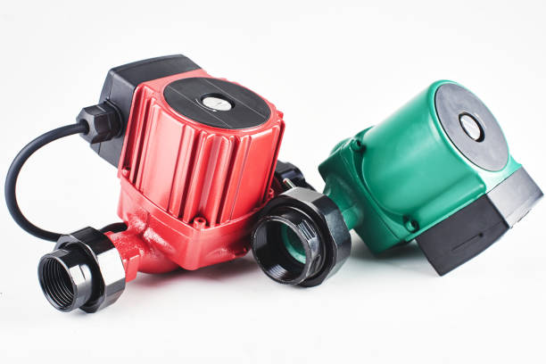 istock Red and green circulation pumps for heating on a white background. 1093488186