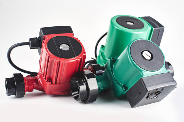 istock Red and green circulation pumps for heating on a white background. 1093488404