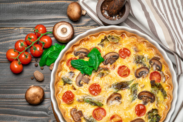 istock Baked homemade quiche pie in ceramic baking form 1093493314