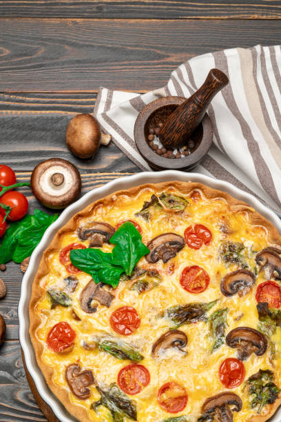 istock Baked homemade quiche pie in ceramic baking form 1093493326