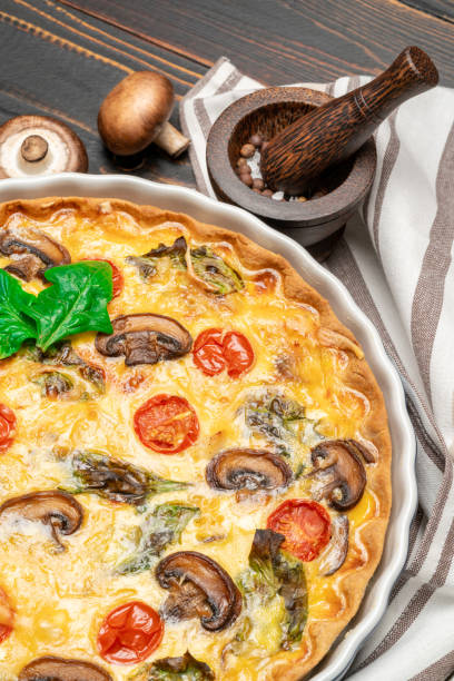 istock Baked homemade quiche pie in ceramic baking form 1093493354