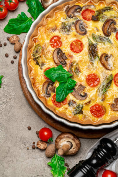 istock Baked homemade quiche pie in ceramic baking form 1093493370