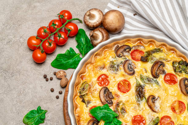 istock Baked homemade quiche pie in ceramic baking form 1093493372