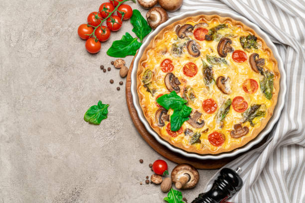 istock Baked homemade quiche pie in ceramic baking form 1093493374