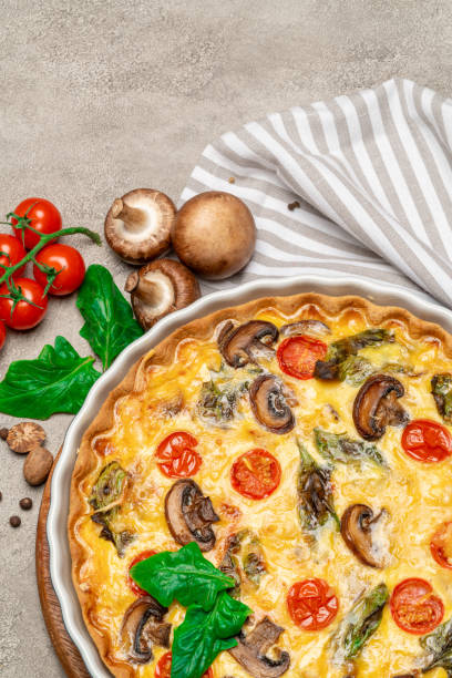 istock Baked homemade quiche pie in ceramic baking form 1093493386