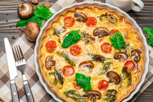 istock Baked homemade quiche pie in ceramic baking form 1093493432
