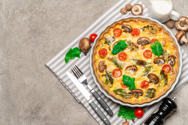 istock Baked homemade quiche pie in ceramic baking form 1093493458