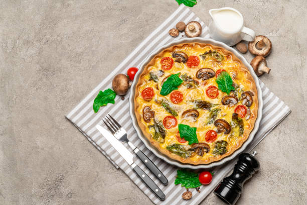 istock Baked homemade quiche pie in ceramic baking form 1093493464