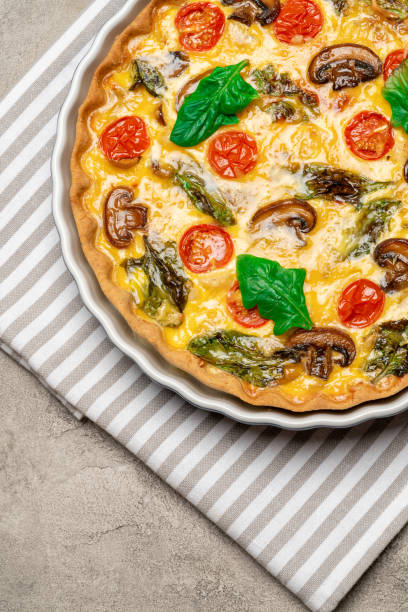 istock Baked homemade quiche pie in ceramic baking form 1093493470