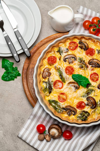 istock Baked homemade quiche pie in ceramic baking form 1093493476