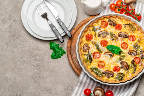 istock Baked homemade quiche pie in ceramic baking form 1093493484