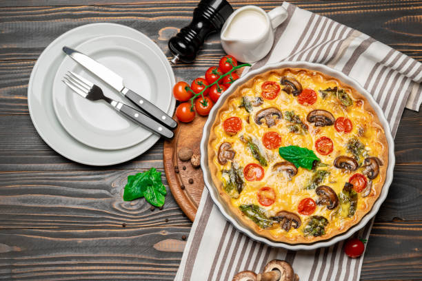 istock Baked homemade quiche pie in ceramic baking form 1093493488
