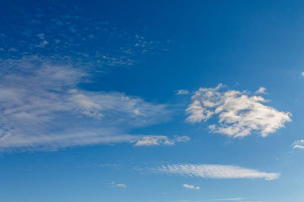 istock White clouds against the blue sky for scenery of an image or article about ecology. 1093495760