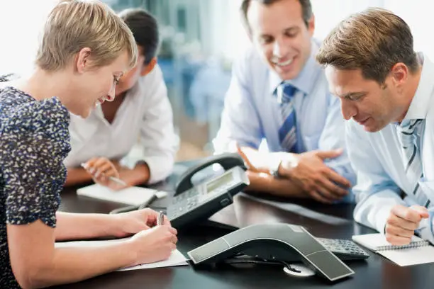 Photo of Business people in meeting on conference call