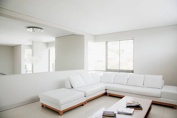 white sofa and mirror in modern living room - simple room potret stok, foto, & gambar bebas royalti