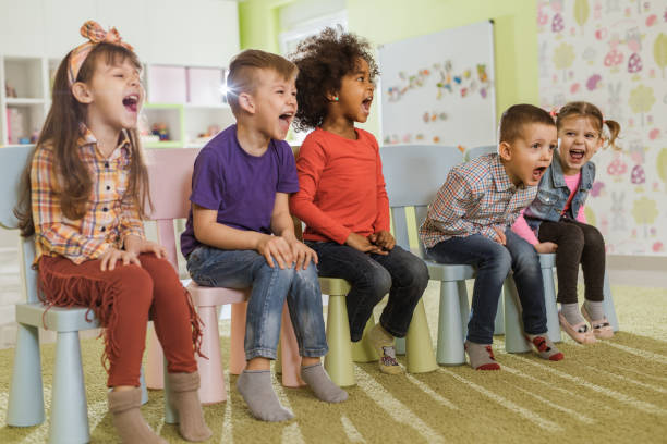 istock Group of kids having fun while screaming in kindergarten. 1093503882
