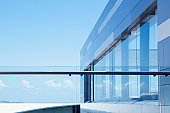 Glass railing on modern building balcony
