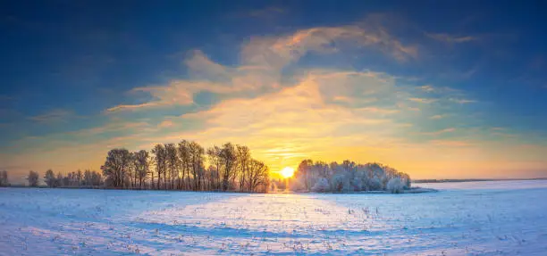 Photo of winter landscape panorama with sunrise