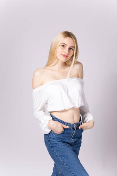 istock Attractive young woman posing over grey background. 1093510134