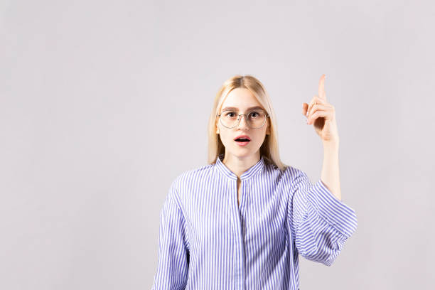 istock Attractive young woman posing over grey background. 1093510614