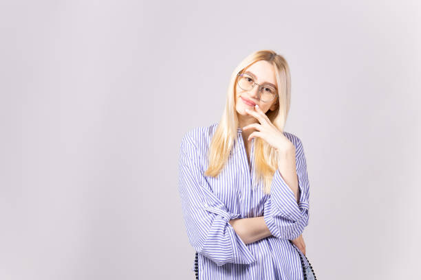 istock Attractive young woman posing over grey background. 1093510650