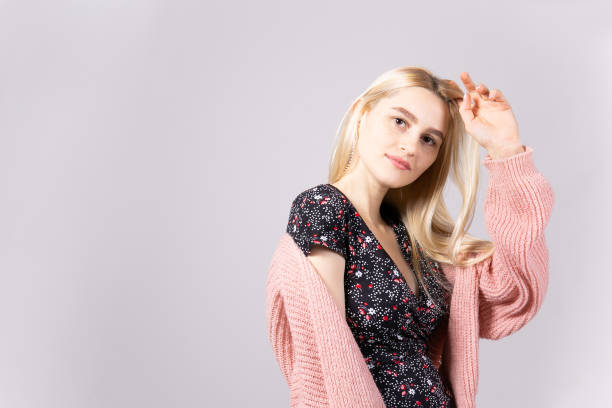 istock Attractive young woman posing over grey background. 1093510950
