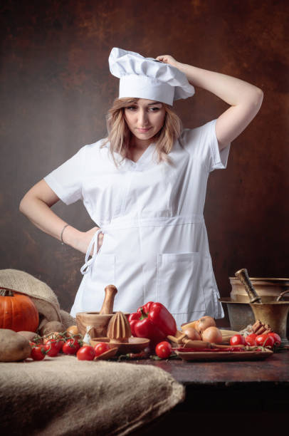 istock Young beautiful girl in a chef uniform . 1093515348