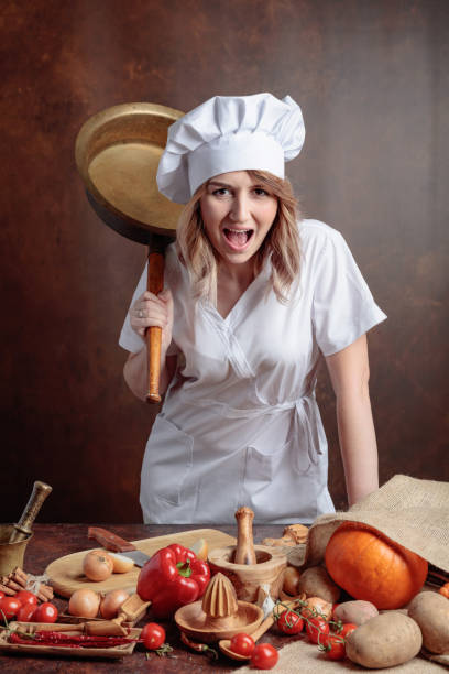 istock Very angry chef with big frying pan in hand. 1093515362