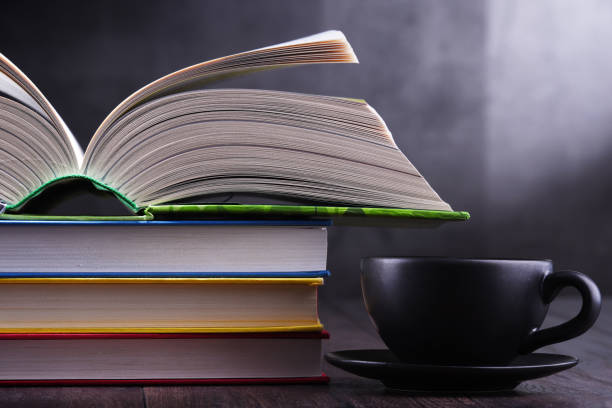 istock Composition with books and cup of coffee on the table 1093515410
