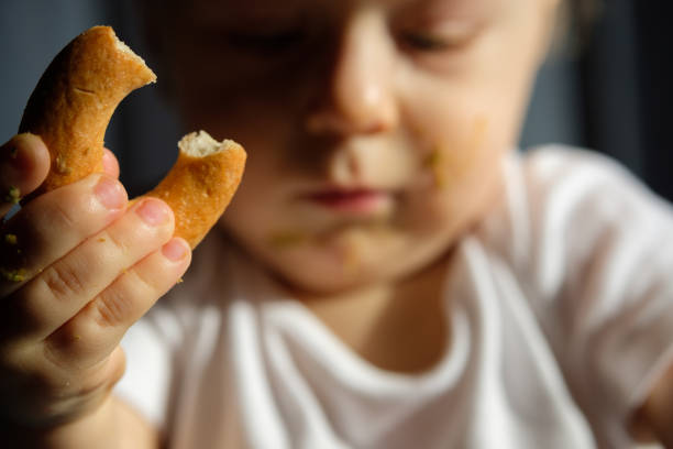 istock Feeding a baby in a highchair 1093517788