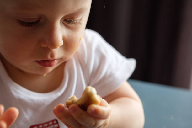 istock Feeding a baby in a highchair 1093518264