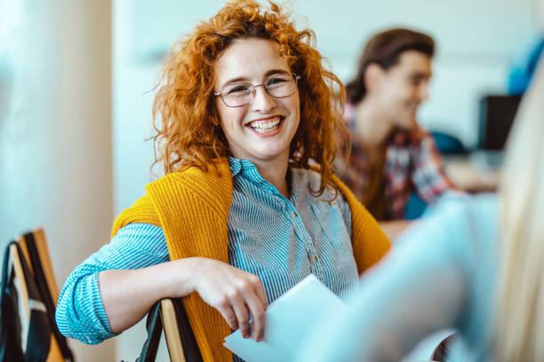 istock Happy female student in the classroom. 1093520410