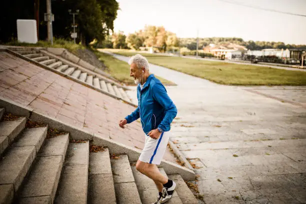 Photo of Senior man running.