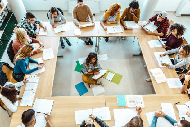 istock Above view of high school students studying in the classroom. 1093522772