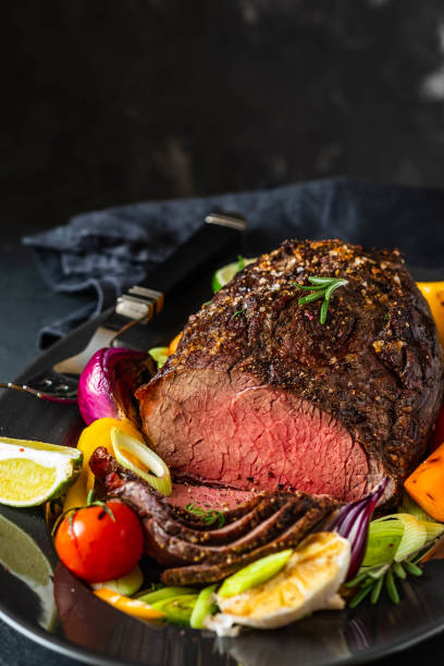 Club Beef steak with pepper sauce and Grilled vegetables on dark wooden background. Roas beef. Copy space.