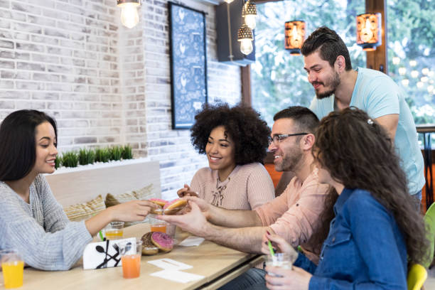 istock Young people having fun together in cafe 1093525926